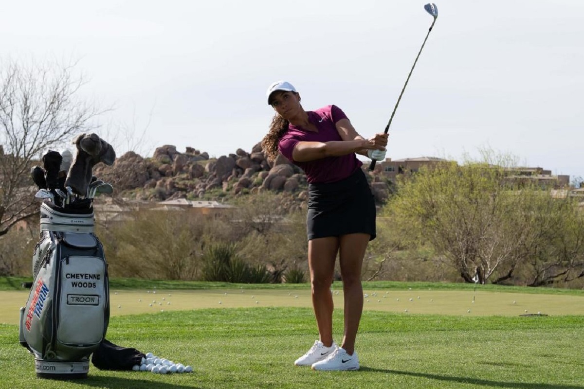 Golfer Cheyenne Woods hitting a golf ball