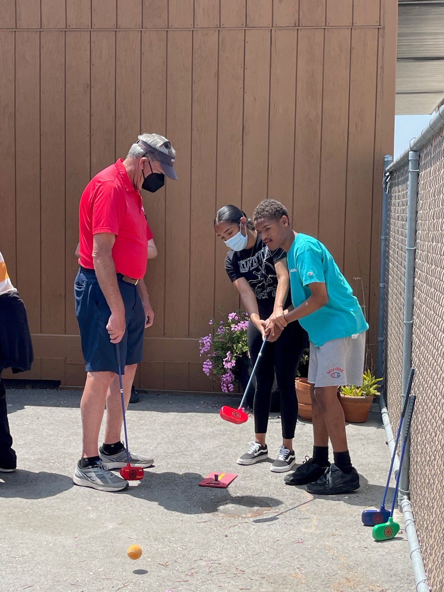 California Country Club Team Member instructing students from Villa Esperanza School.