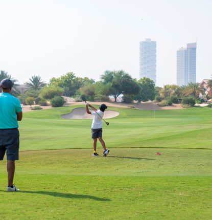 Father and Son playing golf