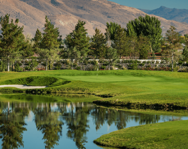 View of Redhawk golf course, showcases the mountains, trees, and water